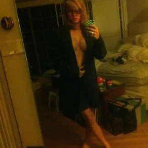 Brie Larson mirror selfie with dark robe on - exposing her cleavage