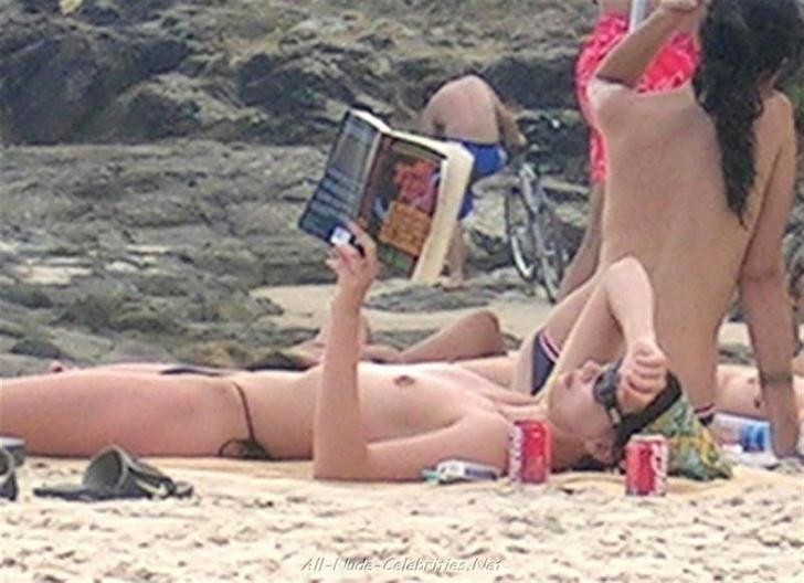 Charlize Theron reading boobs exposed