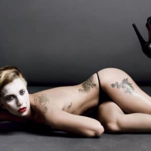 lady gaga topless with black thong laying on ground