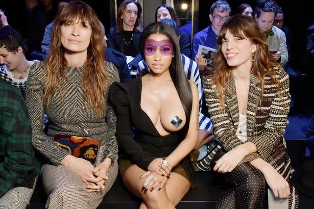 Nicki Minaj sitting breast showing