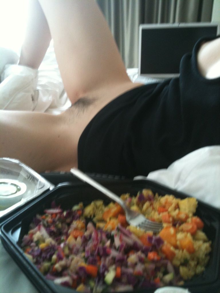 krysten ritter no pants on in bed with a plate of food next to her