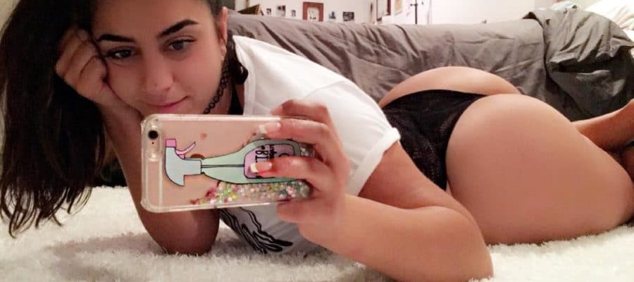 Lena Nersesian hot selfie of her in a thong taking a selfie while laying on the floor