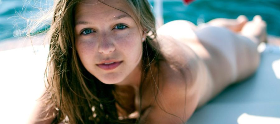 Melissa Benoist totally naked on a yacht looking into the camera