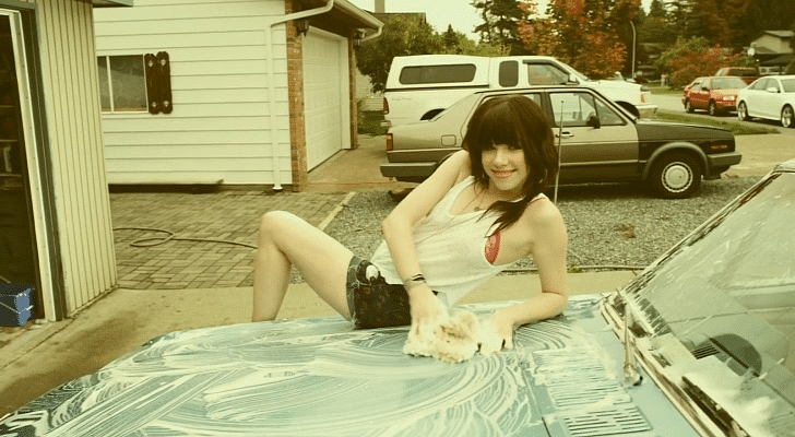 singer carly rae jepsen in her music video call me maybe on a car