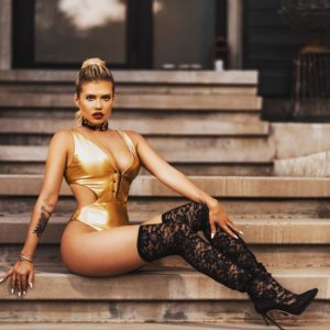 reality star and rapper chanel west coast in golden body suit showing off her legs in high thighs