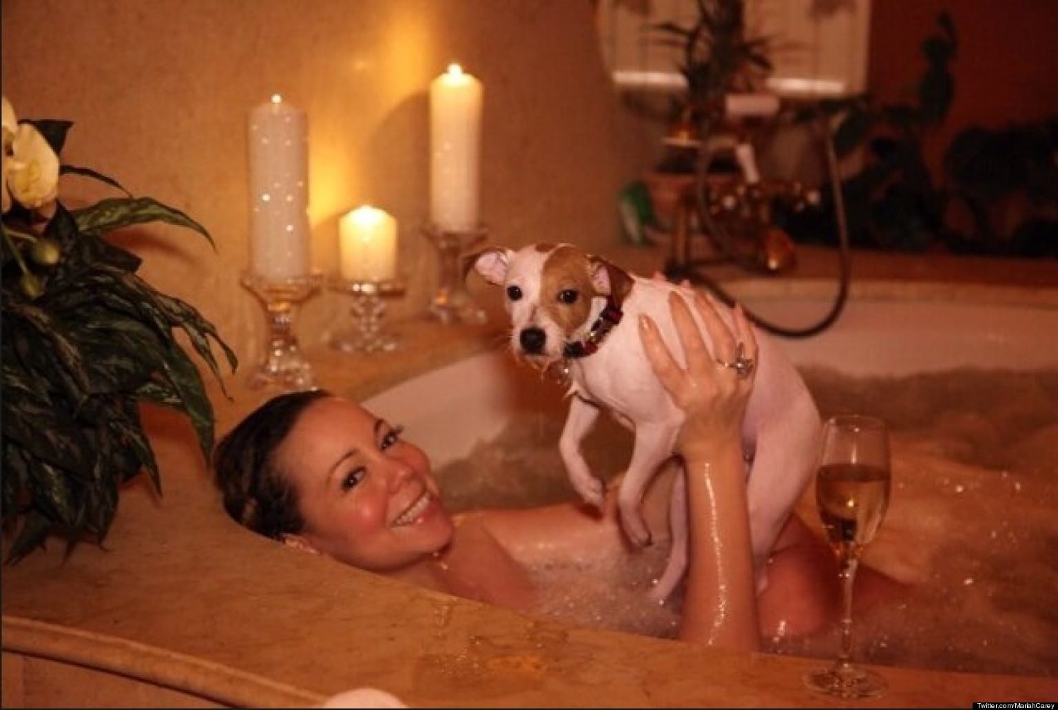 hot pic of mariah carey in her bathtub naked holding up her puppy