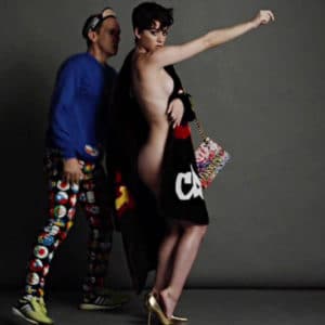 Big breasted Katy Perry in gold heels