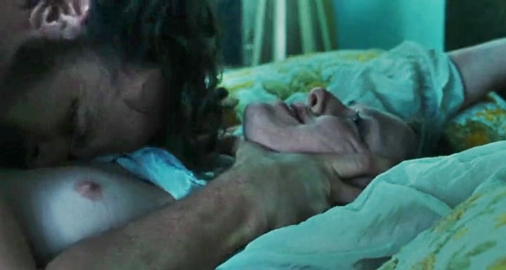 amanda seyfried being choked in bed with her breasts showing