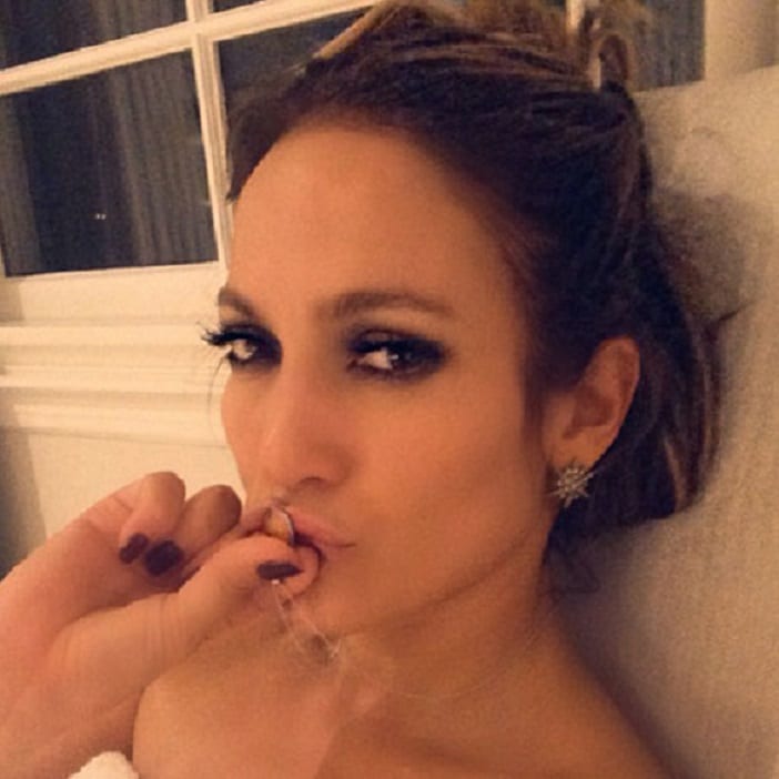 Jennifer Lopez kissing her necklace in selfie pic