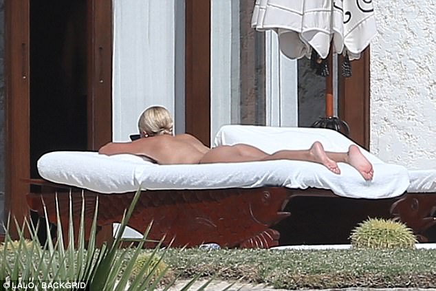 Sofia Richie nude laying on a beach towel